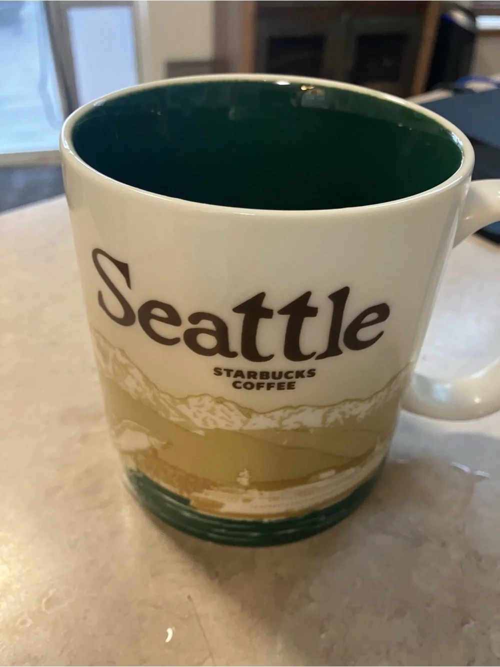 Starbucks White Mug with Green Interior and Green Alaska Lettering